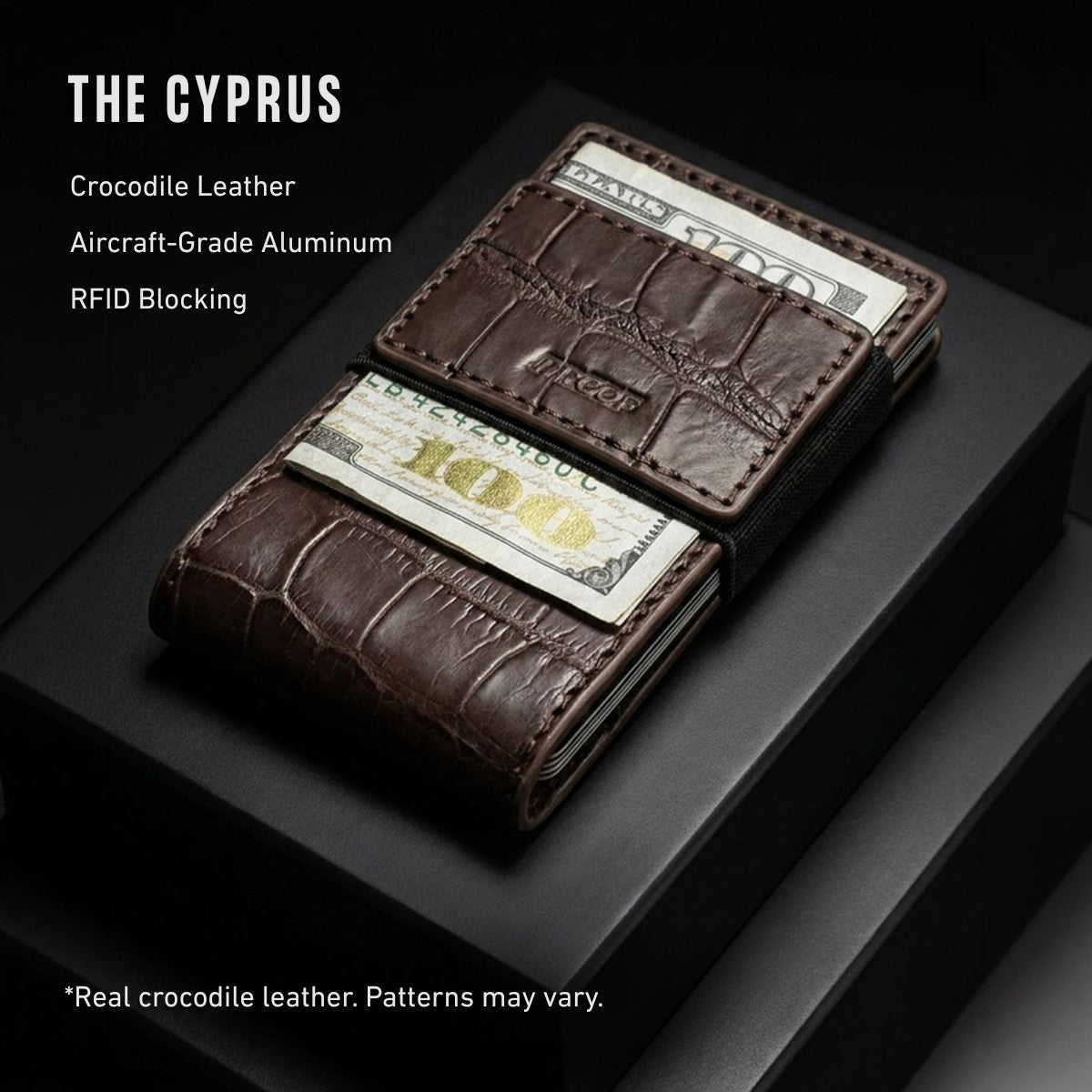 A dark brown crocodile-embossed leather wallet with cash slots, displayed on a black box with text overlays reading 'THE CYPRUS' and product features.